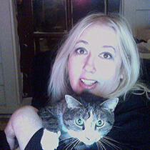 Photo of artist Desi Lucia with one of her beloved kitties. Photo of artist Desi Lucia with one of her beloved kitties.